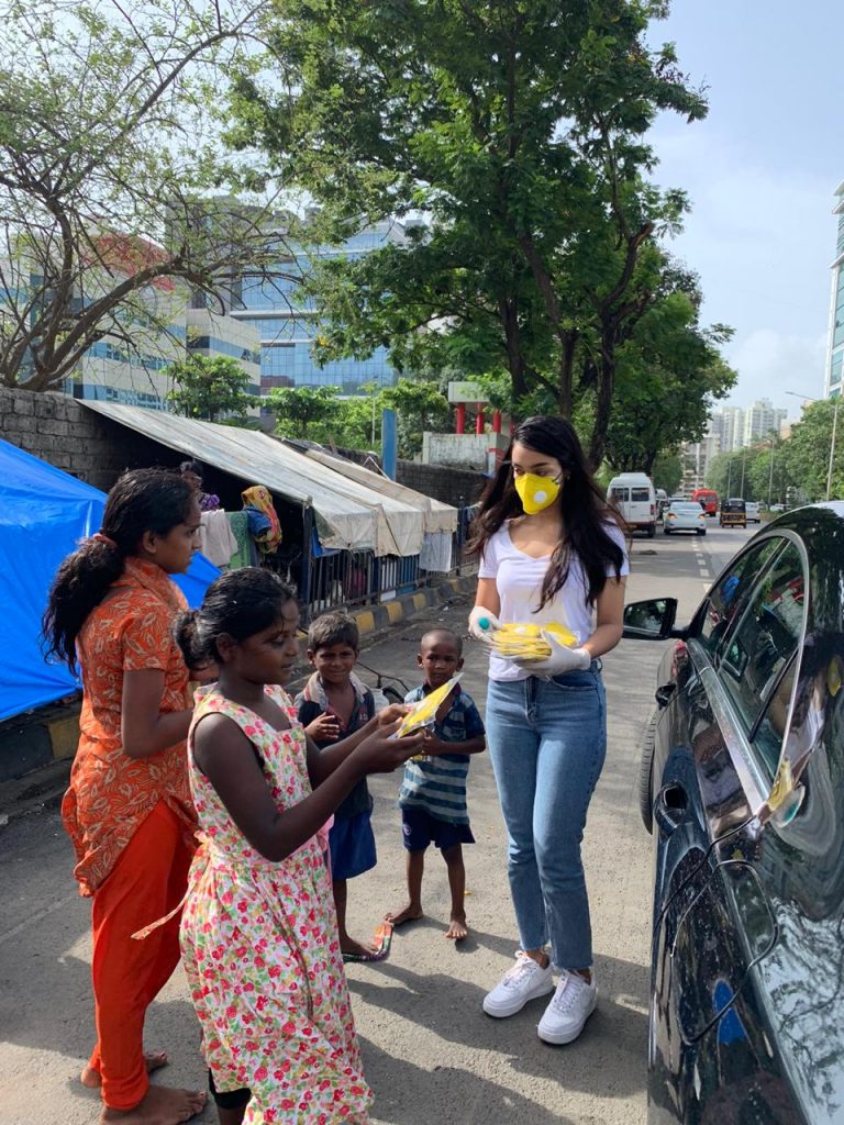 Amrin-Qureshi-Distributing-Mask